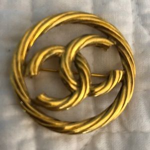 Authentic CHANEL pin in gold tone.
